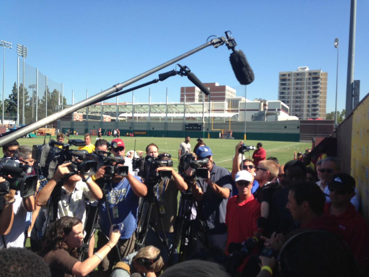 The media surround USC Coach Steve Sarkisian Aug. 27.