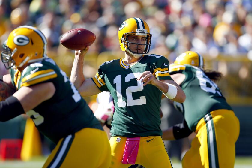 Green Bay Packers quarterback Aaron Rodgers looks to throw against the St. Louis Rams during a game on Oct. 11.