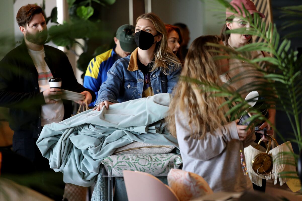 Lindsay Taylor waits in line to purchase merchandise at the Wing in West Hollywood.