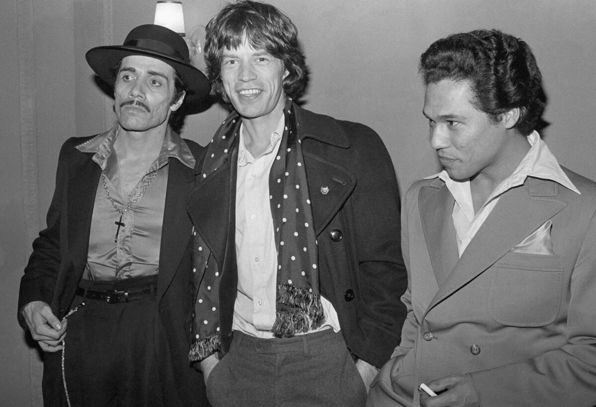 Edward James Olmos, left, backstage with Mick Jagger and Danny Valdez on March 23, 1979.