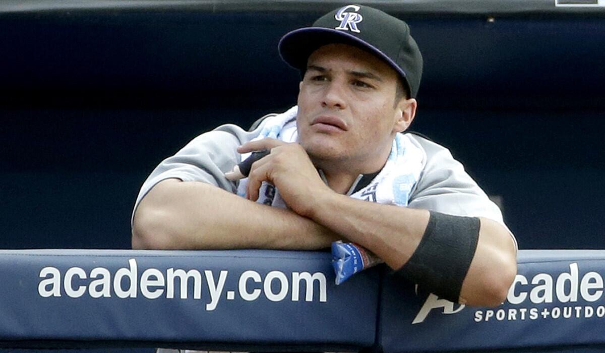 Rockies third baseman Nolan Arenado watches from the dugout during a game against the Braves on Saturday in Atlanta.