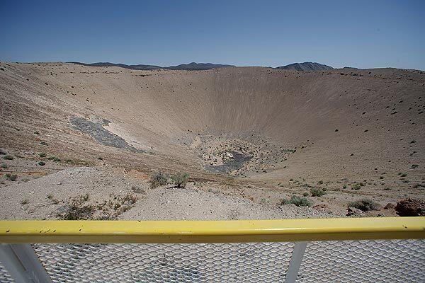 Sedan Crater, on the Nevada Test Site, was formed on July 6, 1962, when the U.S. Atomic Energy Commission conducted an excavation experiment using a 104-kiloton thermonuclear device. The explosion detonated 635 feet underground, displaced about 12 million tons of earth, and created a crater 1,280 feet in diameter and 320 feet deep.