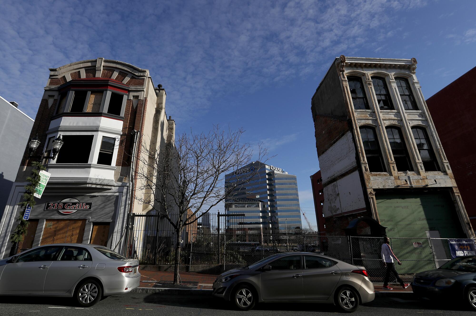 A pair of vacant buildings frame the Chase Bank building in the distance in big-business-friendly Wilmington, Del.