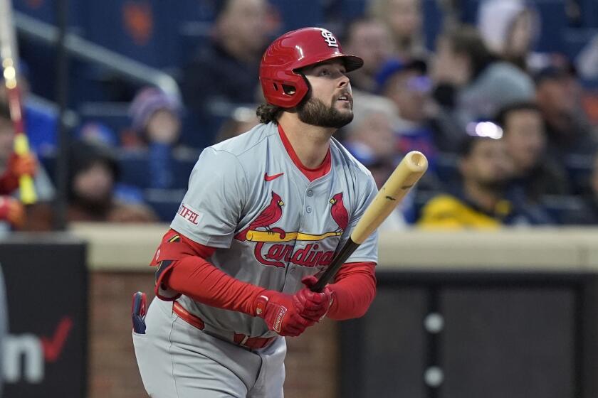 St. Louis Cardinals' Alec Burleson watches his three-run home run against the New York Mets during the second inning of a baseball game Friday, April 26, 2024, in New York. (AP Photo/Frank Franklin II)
