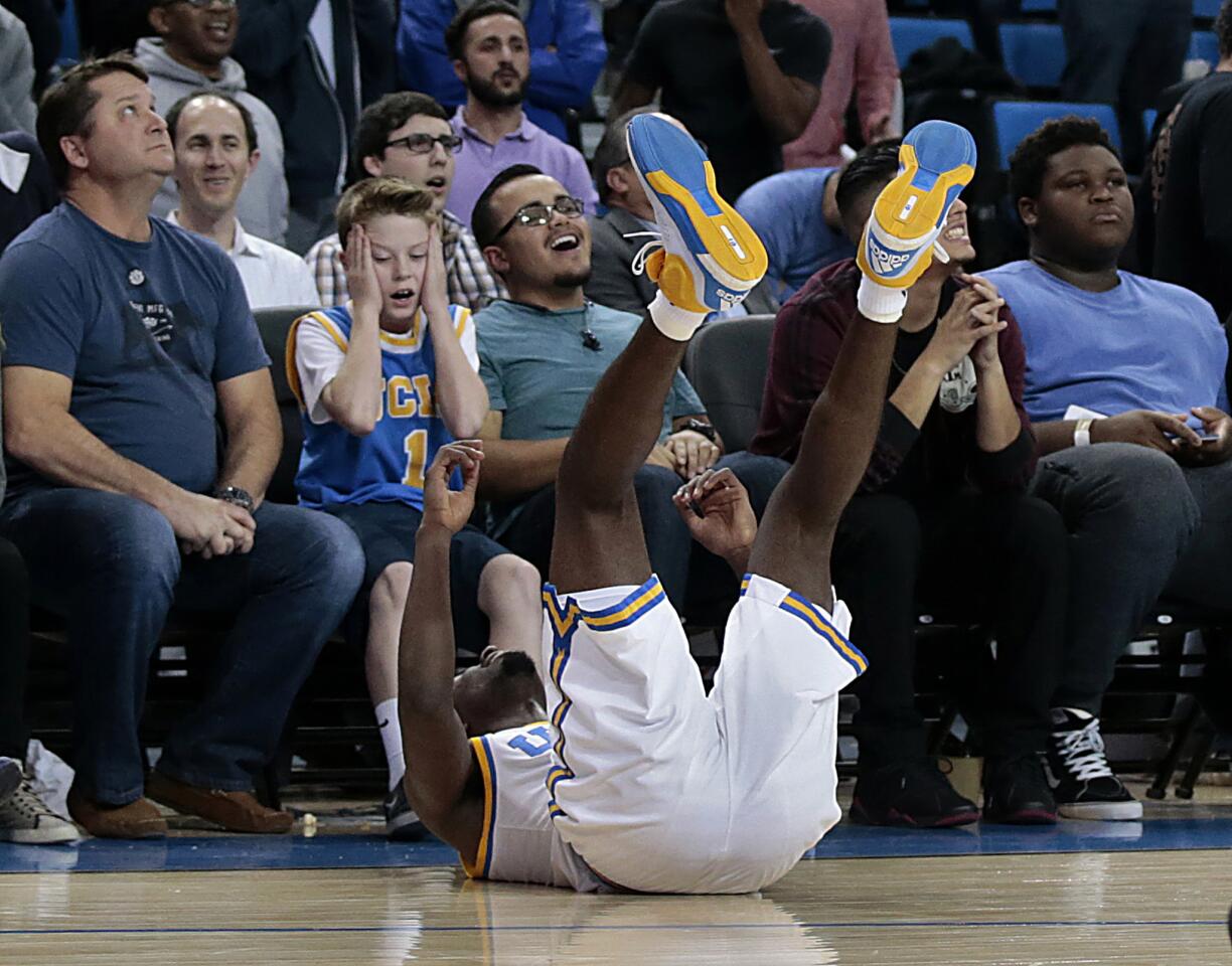 UCLA guard Isaac Hamilton lands on the floor after hoisting a desparation shot that missed at the buzzer leaving the Bruins in an 86-84 loss to Washington at Pauley Pavilion on Thursday.