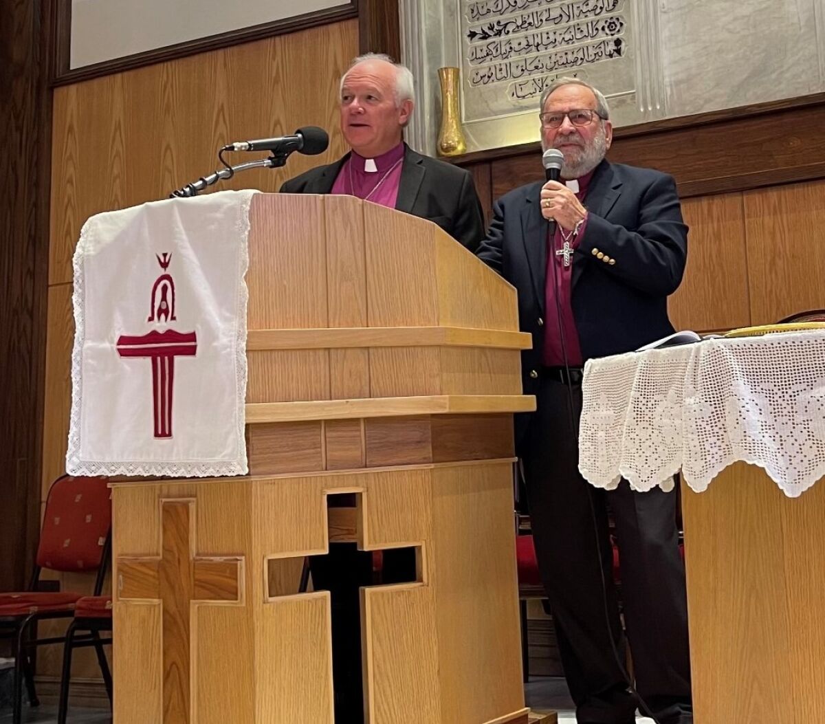 The Rev. Jack Baca preaching at a Presbyterian church in Damascus in October; interpreter on the right.