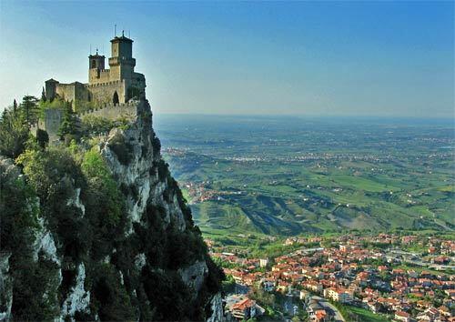 San Marino Guaita Tower, one of three crowning Mt. Titano, overlooks the city of San Marino below. Set on an outcropping of the Apennine Mountains in east-central Italy, San Marino is the worlds oldest republic, based on its founding in the early 4th century.