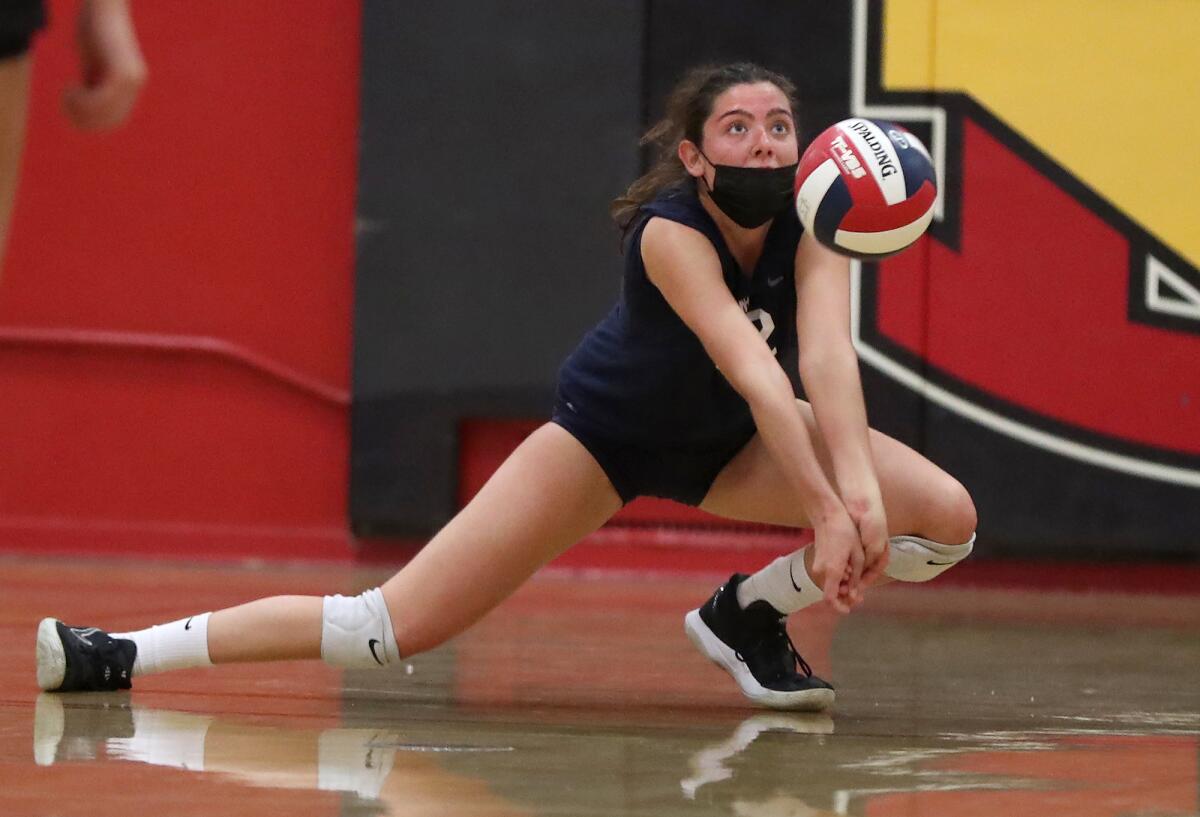 Newport Harbor's Quinn Perry (12) digs a hard-hit ball in the CIF State SoCal Regional Div. II playoffs at Mission Viejo.
