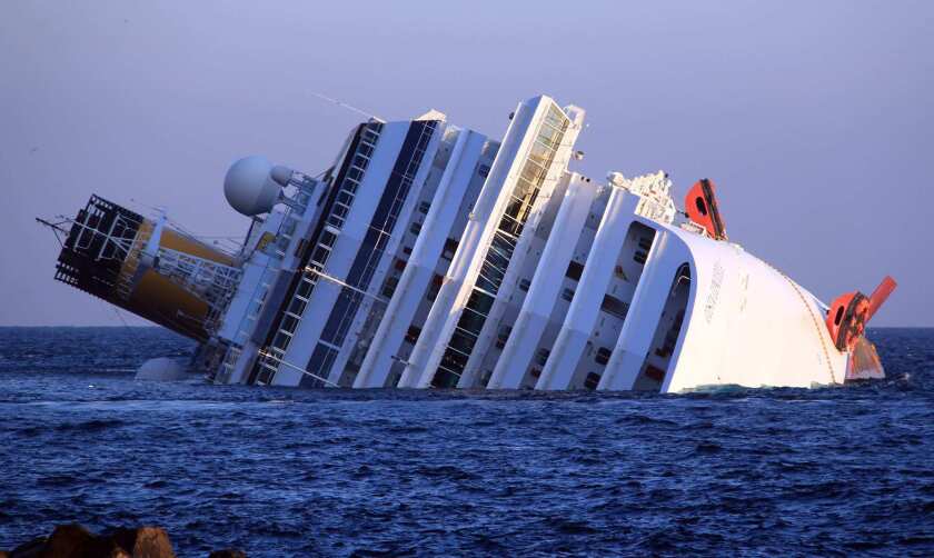 The Costa Concordia cruise ship lists at 80 degrees off the island of Giglio, Tuscany.