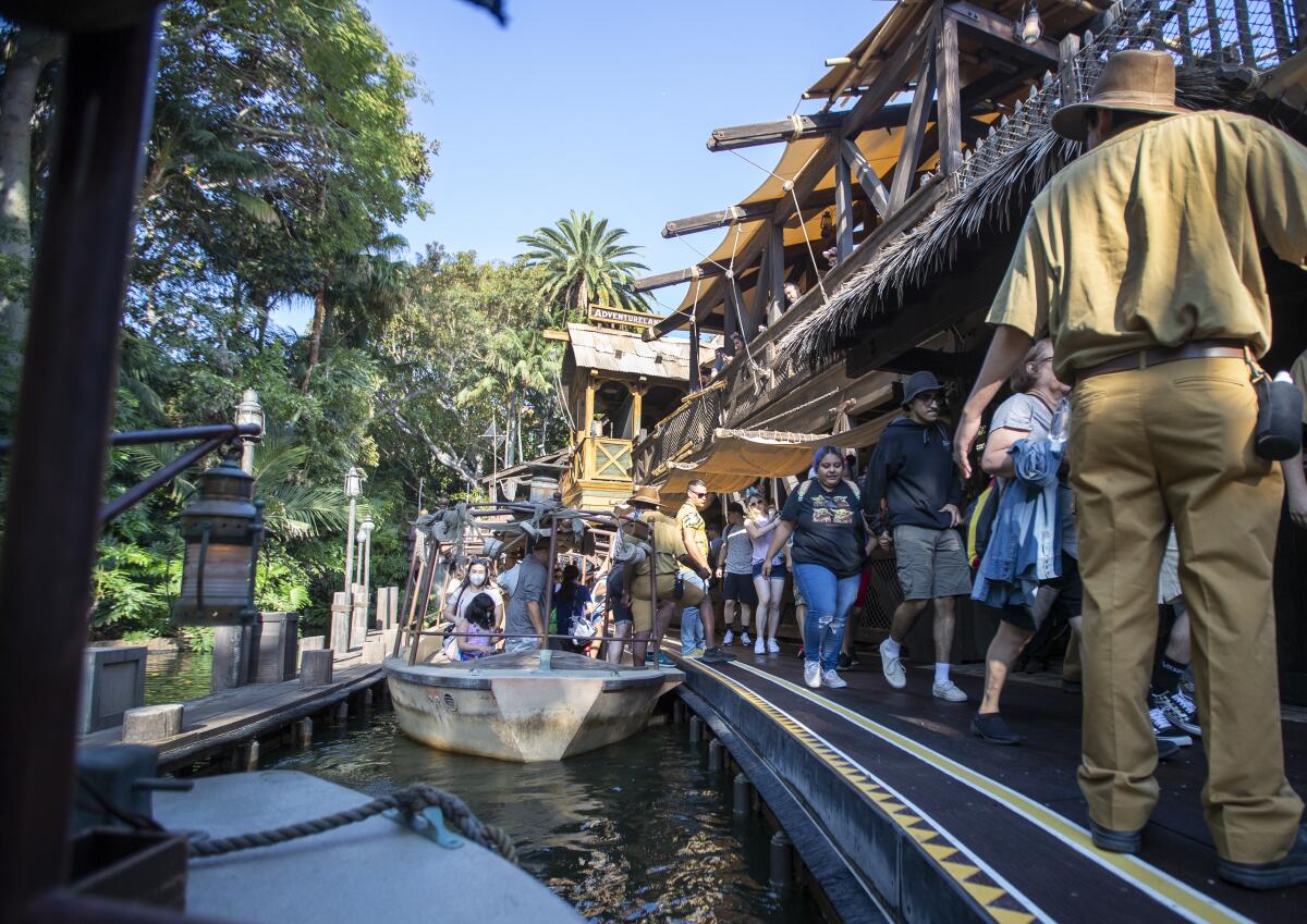 People disembark a boat at Disneyland 