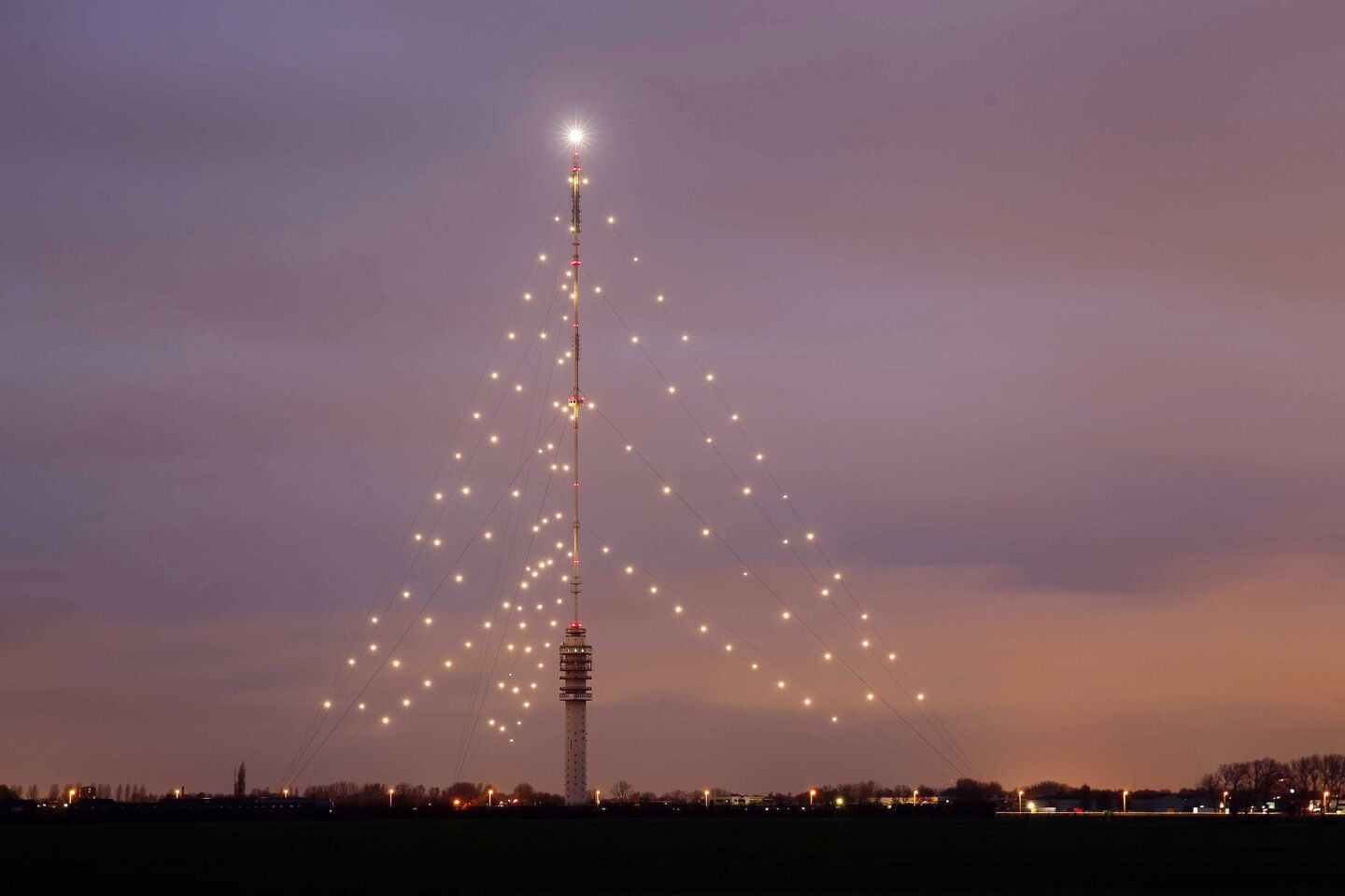 It's billed as the world's largest Christmas tree, even though it's not a tree at all: Holiday lights adorn the Gerbrandy Tower in IJsselstein, The Netherlands. (It's a radio and broadcast tower that stands 1,203.41 feet tall.)
