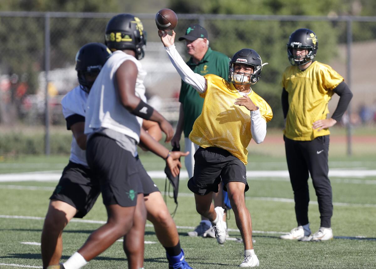 Golden West College quarterback Nathaniel Espinoza throws during practice in Huntington Beach.