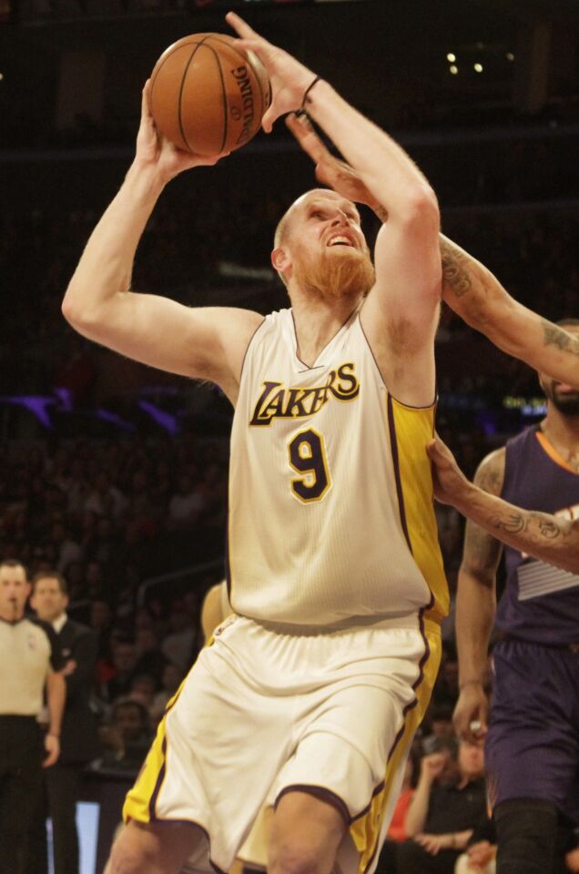Lakers center Chris Kaman looks to shoot during the Lakers' 115-99 win over the Phoenix Suns at Staples Center on Sunday.