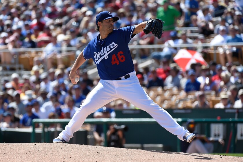 Dodgers' Mike Bolsinger pitches against the Milwaukee Brewers during a spring training game on March 14.