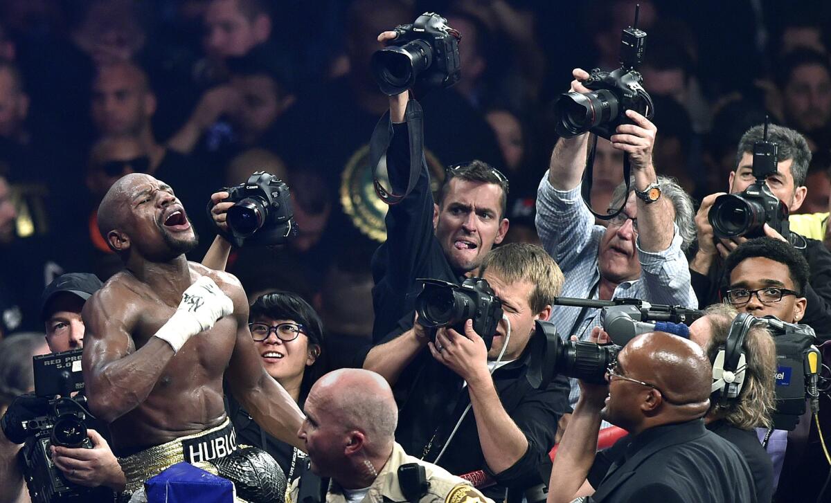 Floyd Mayweather Jr. celebrates after defeating Manny Pacquiao by unanimous decision in their welterweight title fight on May 2.