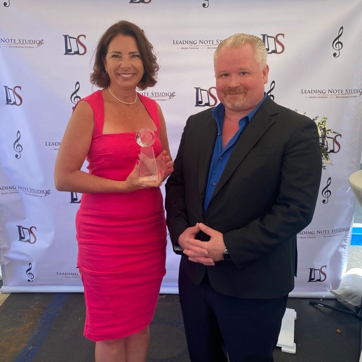 (L-R) Camille Hastings, owner of Leading Note Studios, with the LNS award presented March 22 by Marty Fort, director of MASS.