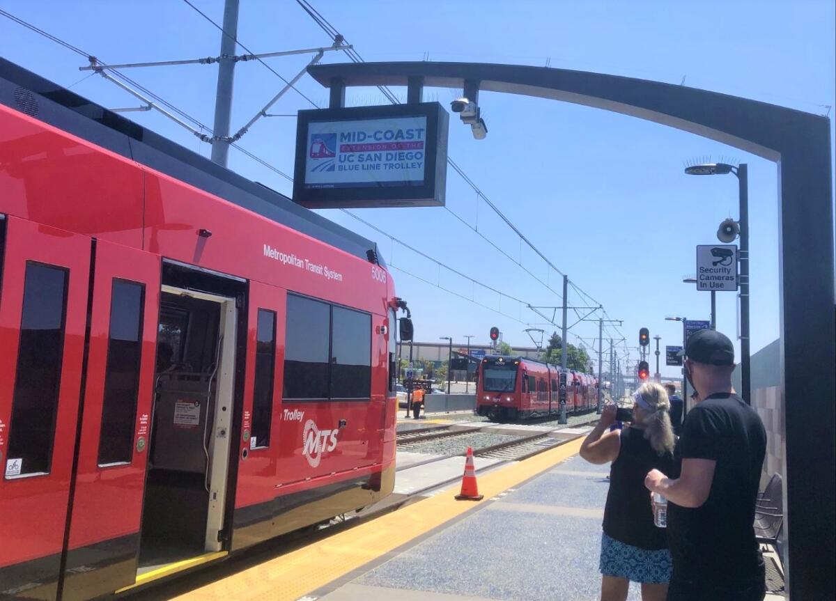 Sightseers took photos and free rides at three new Blue Line trolley stations on Aug. 28. The Balboa station opens Nov. 21.