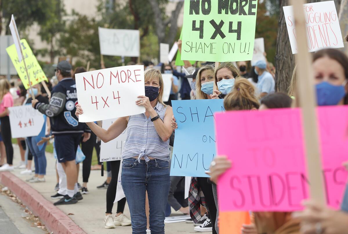 Parents and teachers protest in front of Corona del Mar High School.