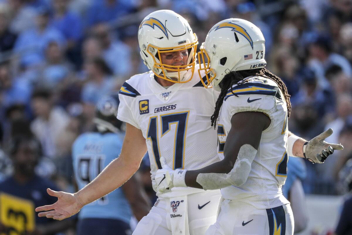 Quarterback Philip Rivers and running back Melvin Gordon discuss a failed play during a loss in Tennessee on Oct. 20, 2019.
