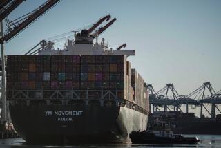 WILMINGTON, CALIF. - DECEMBER 18: The container ship YM Movement docks at the TraPac terminal where longshoremen will plug the shit into the terminal’s power grid so that the ship won’t have to run off of generators while docked at the Port of LA on Wednesday, Dec. 18, 2019 in Wilmington, Calif. (Kent Nishimura / Los Angeles Times)