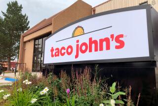 FILE - A sign stands outside the corporate headquarters of Cheyenne-based Taco John's on Aug. 1, 2019, in Cheyenne, Wyo. Declaring a mission to liberate "Taco Tuesday" for all, Taco Bell asked U.S. regulators Tuesday, May 16, 2023, to force Wyoming-based Taco John's to abandon its longstanding claim to the trademark. (AP Photo/Mead Gruver)