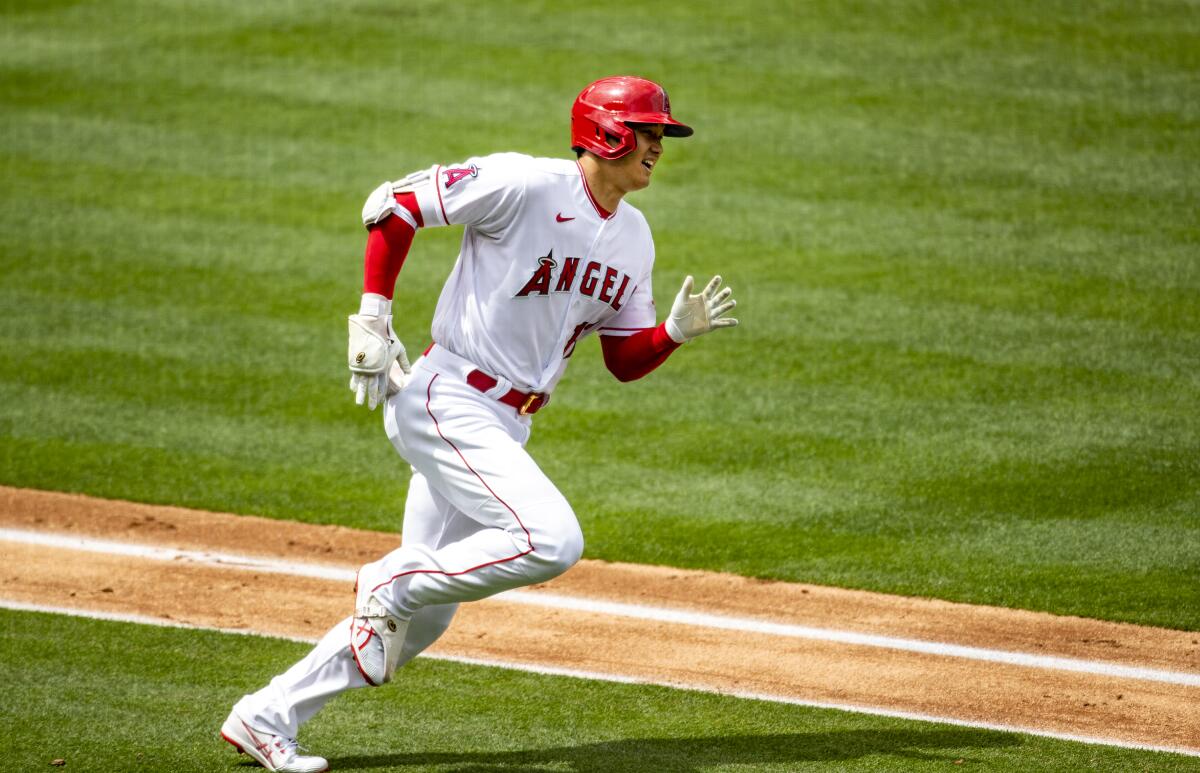 Angels designated hitter Shohei Ohtani runs the bases after hitting a solo homer.