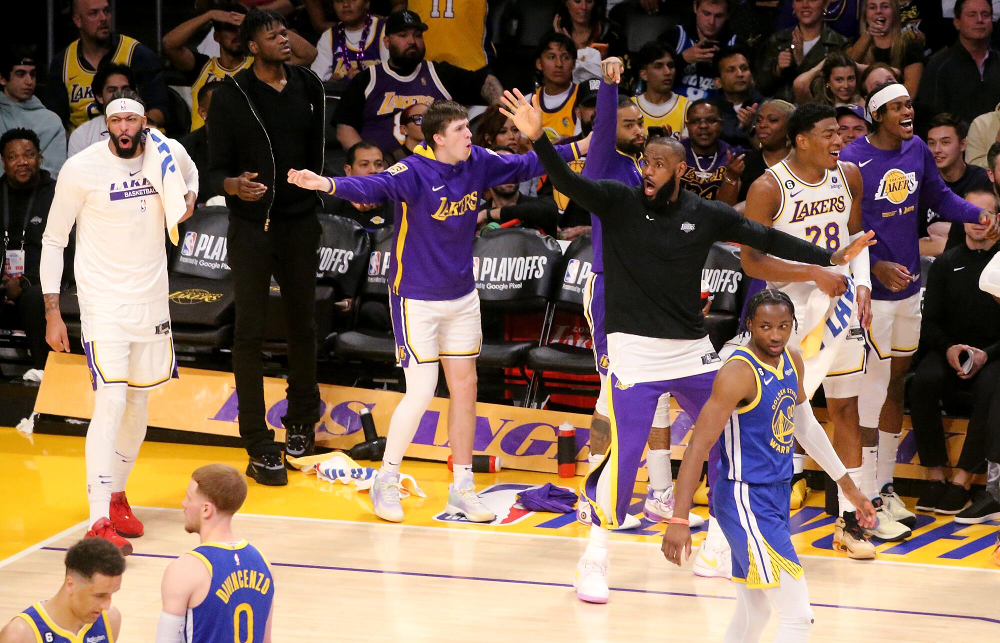 The Lakers' bench gets animated as L.A. pulls away from Golden State in the second half.