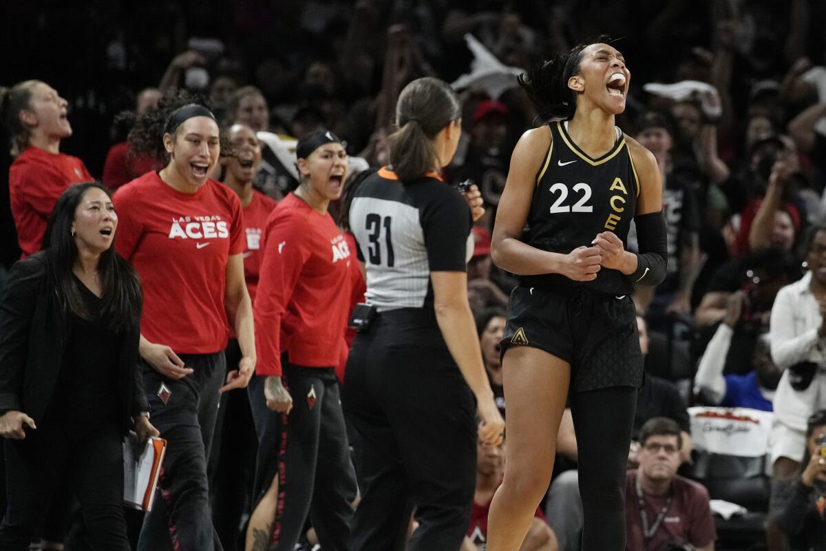 Las Vegas Aces forward A'ja Wilson (22) celebrates after a play against the Seattle Storm during the second half in Game 2 of a WNBA basketball semifinal playoff series Wednesday, Aug. 31, 2022, in Las Vegas. (AP Photo/John Locher)