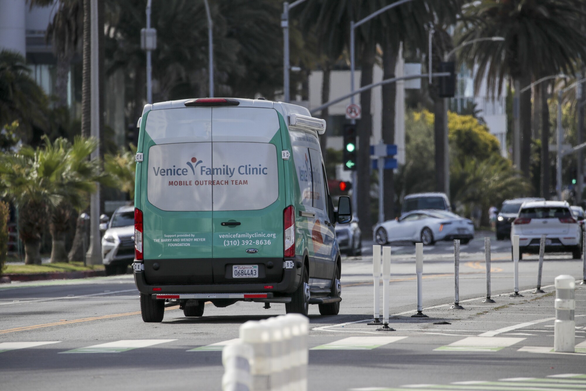 Venice Family Clinic's mobile unit travels along Pacific Coast Highway en route to making house calls at Palisades Park.