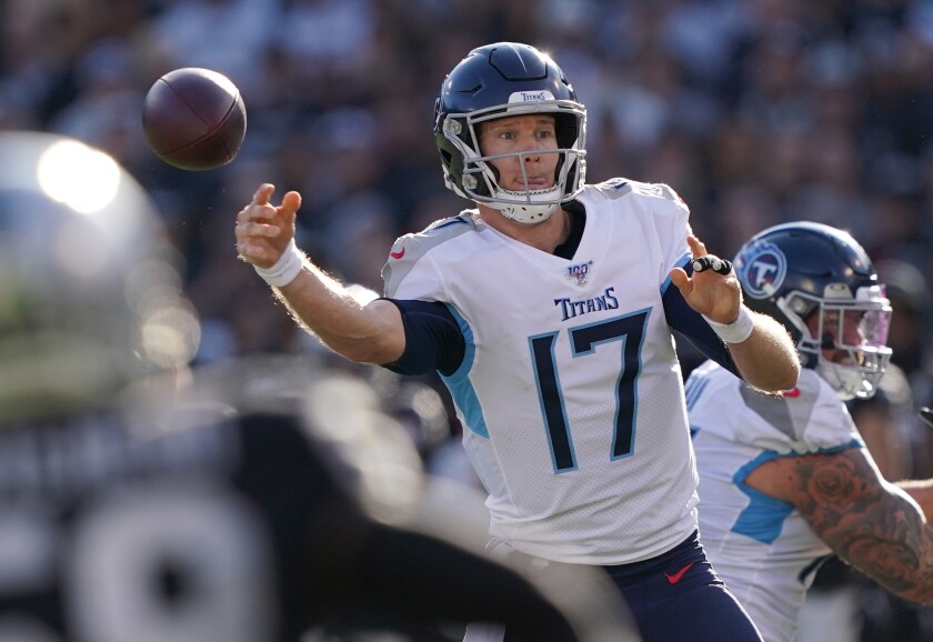 Tennessee Titans quarterback Ryan Tannehill lets go of a pass.