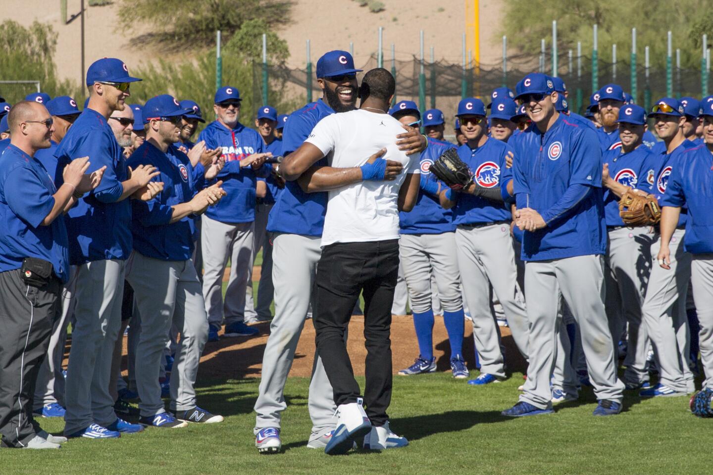Jason Heyward hugs Dexter Fowler after Fowler after Fowler surprised the team by announcing he had signed a one-year deal on Feb. 25, 2016.