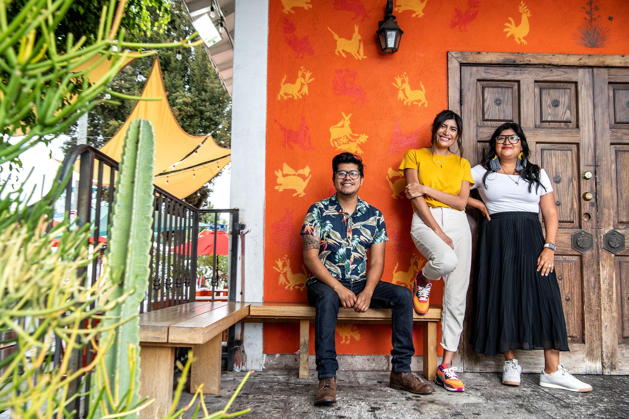 Fernando, left, Bricia, center, and Paulina Lopez at Guelaguetza.