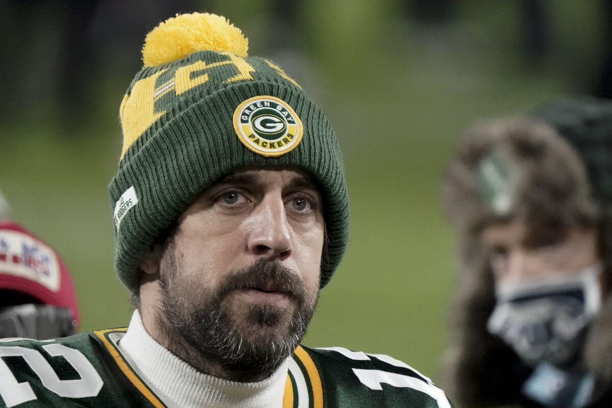 FILE - In this Sunday, Jan. 24, 2021, file photo, Green Bay Packers quarterback Aaron Rodgers (12) walks off the field after the NFC championship NFL football game against the Tampa Bay Buccaneers in Green Bay, Wis. In a news conference, Monday, July 5, 2021, reigning NFL MVP Rodgers said he has spent this offseason focusing on improving himself in every respect, and that goes beyond making sure he’s in top physical shape. (AP Photo/Morry Gash, File)