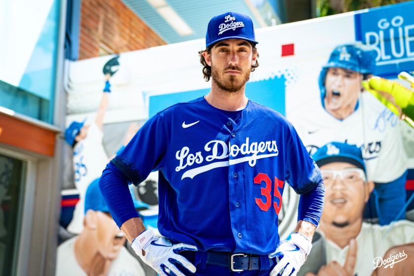 Dodgers outfielder Cody Bellinger donning the team's Nike City Connect jersey and hat.