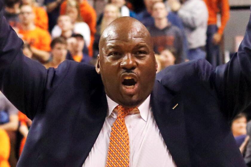 FILE - In this Jan 19, 2016, file photo, Auburn assistant coach Chuck Person celebrates after they defeated Alabama 83-77 in an NCAA college basketball game in Auburn, Ala. Person was identified in court papers and is among 10 people facing federal charges in Manhattan federal court, Tuesday, Sept. 26, 2017, in a wide probe of fraud and corruption in the NCAA, authorities said. (Todd J. Van Emst/Opelika-Auburn News via AP, File)