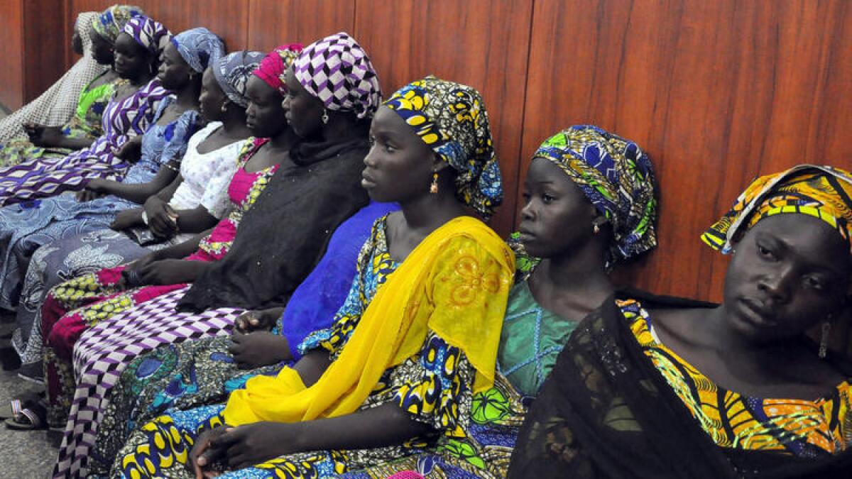 Schoolgirls from the Nigerian village of Chibok who escaped from Boko Haram kidnappers wait to talk with the governor of Borno state in Maiduguri in June.