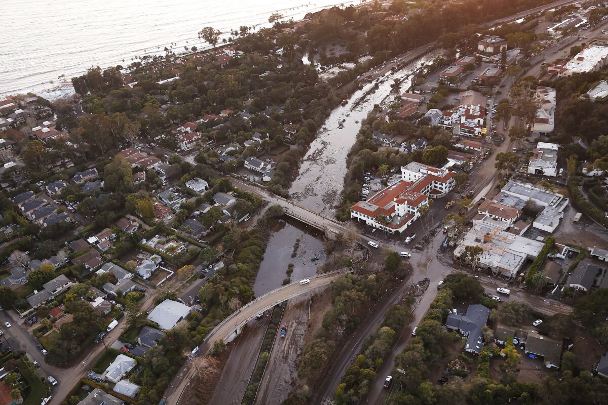 The 101 Freeway is closed as mud and debris clog the roadway at the Olive Mill Road overpass in Montecito January 10, 2018, after a rainstorm sent mud and debris roaring through neighborhoods. (Al Seib / Los Angeles Times) Al Seib / Los Angeles Times