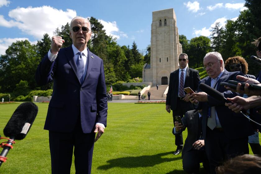 U.S. President Joe Biden speaks to the press as he attends a wreath laying ceremony at the Aisne-Marne American World War One Cemetery in Belleau, France, Sunday, June 9, 2024. (AP Photo/Evan Vucci)