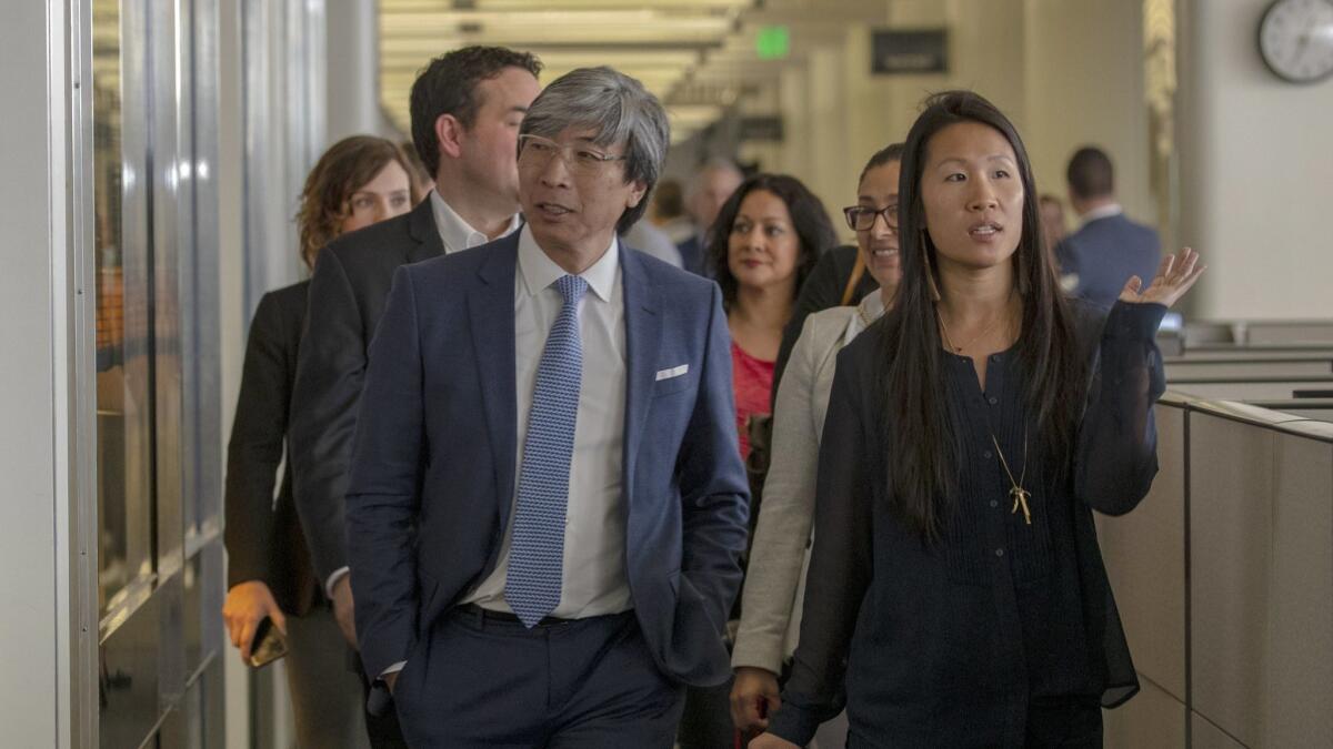 Dr. Patrick Soon-Shiong, new owner of the Los Angeles Times, visits the downtown L.A. newsroom with Assistant Business Editor Andrea Chang in April.