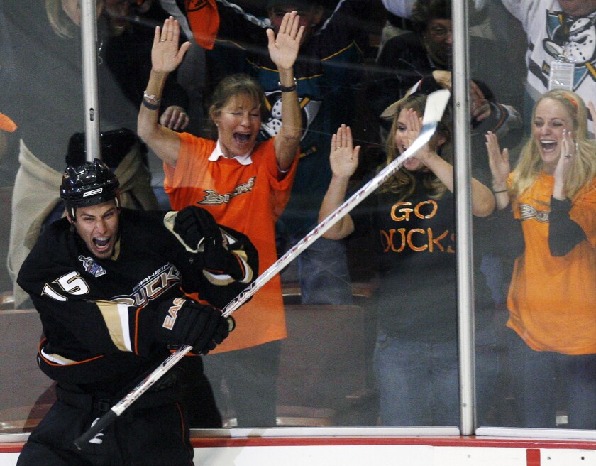 Cheering fans are seen behind an exultant Ryan Getzlaf after a goal.