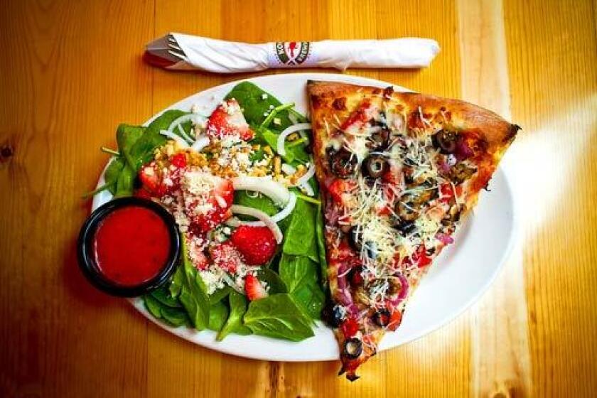 At the Kona Brewing Co., the daily special features a slice of pizza and a salad.