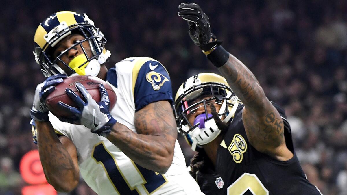 Rams receiver Tavon Austin hauls in Jared Goff's first touchdown pass againt Saints defensive back B.W. Webb during the first quarter Sunday.
