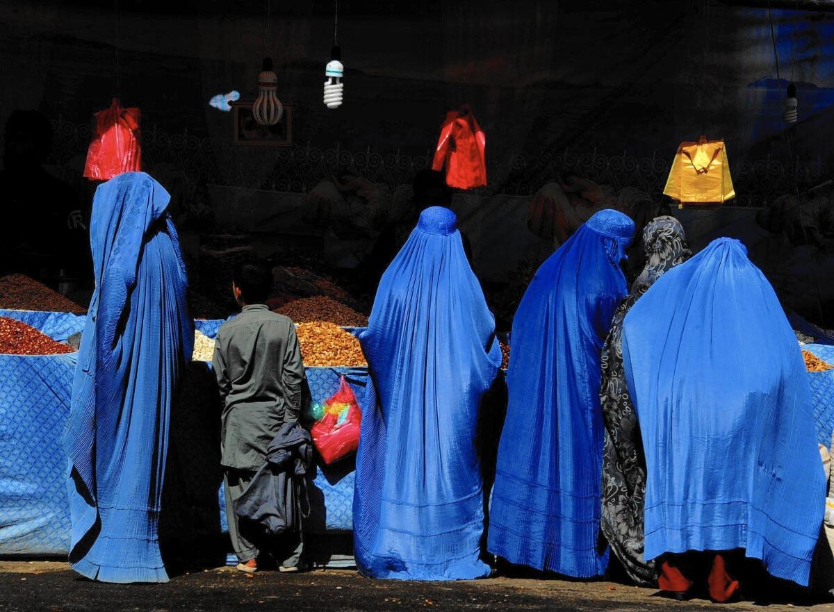 Afghan women at a market in Herat. President Ashraf Ghani, speaking in October, said that Afghan women are subject to "shocking" levels of harassment.