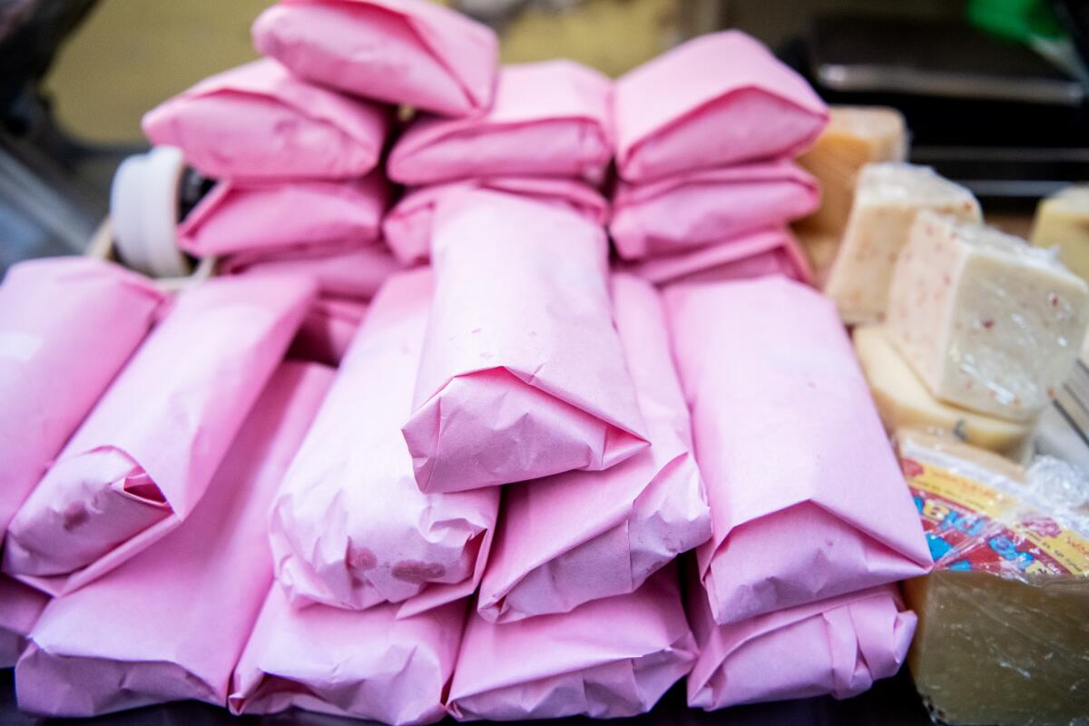 Stacks of sandwiches inside Roma Market.