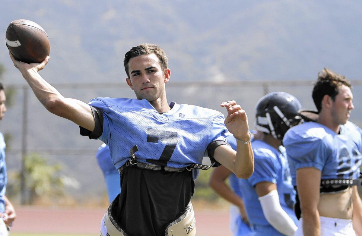 Crescenta Valley High School football player #7 quarterback Brian Gadsby throws the ball during drills at the La Crescenta school's football field on Tuesday, Aug. 19, 2014.