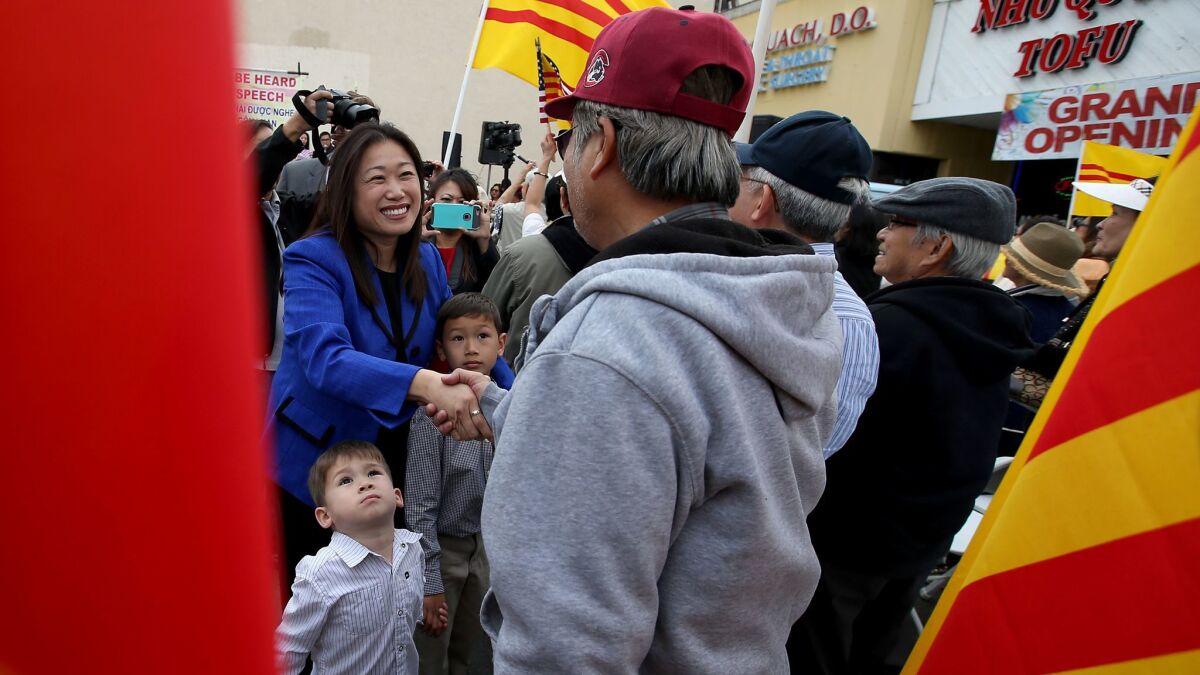California State Senator Janet Nguyen (R-Garden Grove) is greeted by supporters after speaking at a rally organized by members of Orange County's Vietnamese-American community in Westminster.