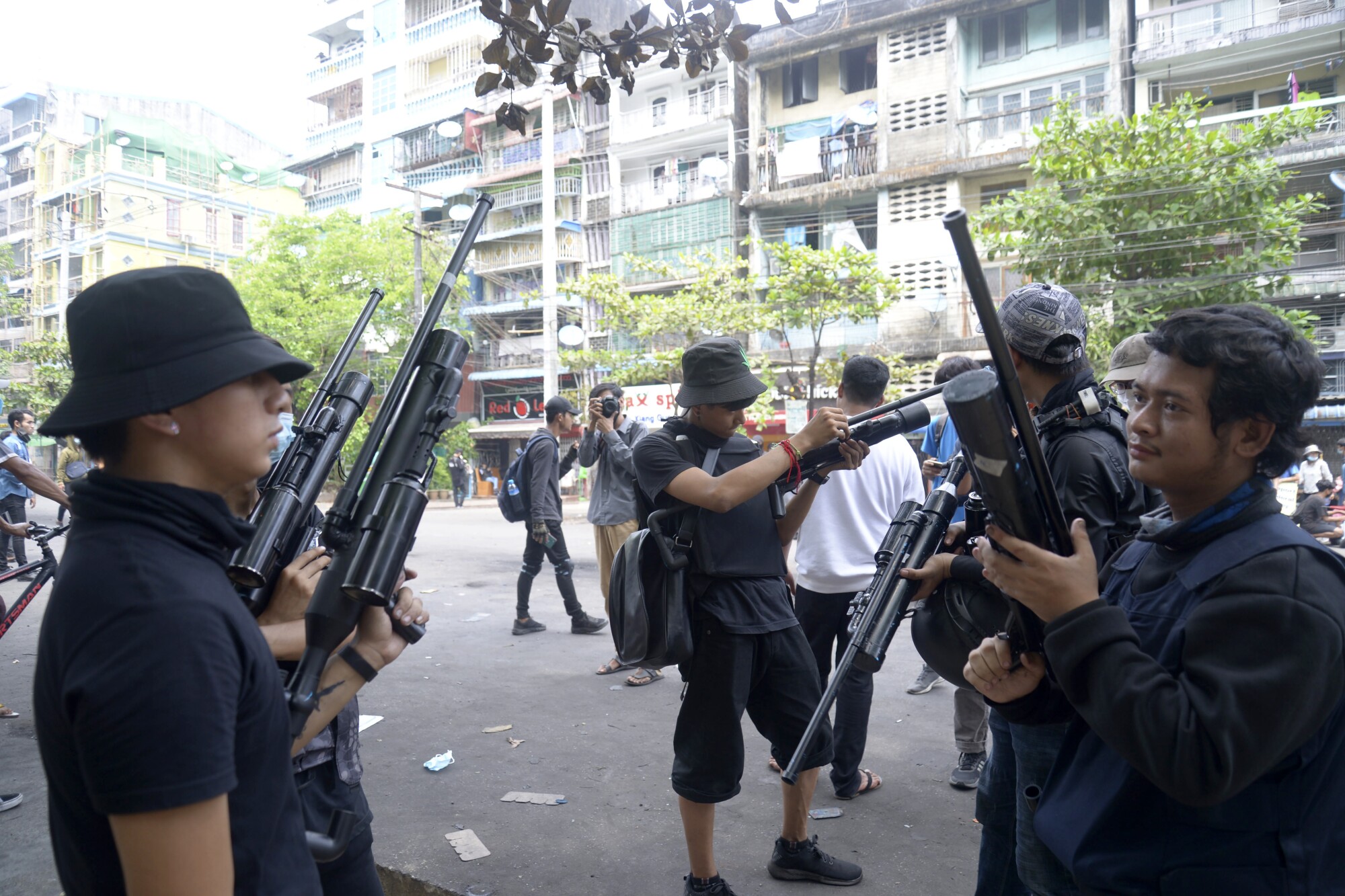 Protesters with air rifles in Yangon. 