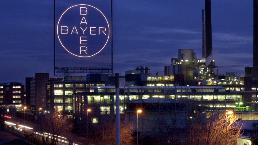 A Bayer plant glows in Leverkusen, Germany. The agrochemical and pharmaceutical giant has opted not to fight U.S. regulators over a ban on its Belt brand insecticide.