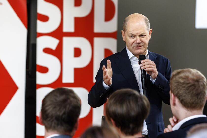 German Chancellor Olaf Scholz speaks at a Citizens' Dialogue organized by the Lüneburg SPD to kick off his party's European election campaign, in Luneburg, Germany, Saturday April 27, 2024. (Markus Scholz/dpa via AP)