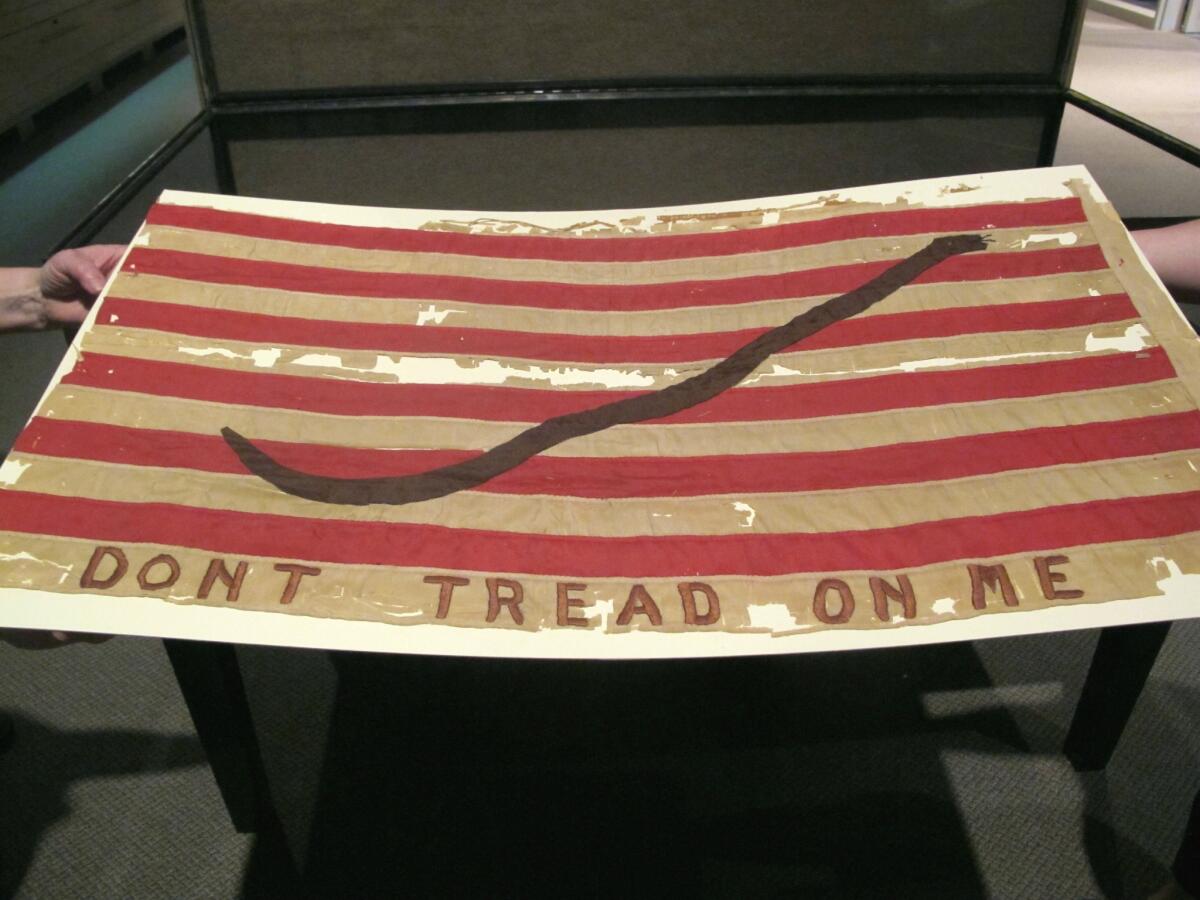 An old American naval flag touts the phrase: "Don't tread on me." History's next miniseries, "Sons of Liberty," will look at the origins of the American Revolution.